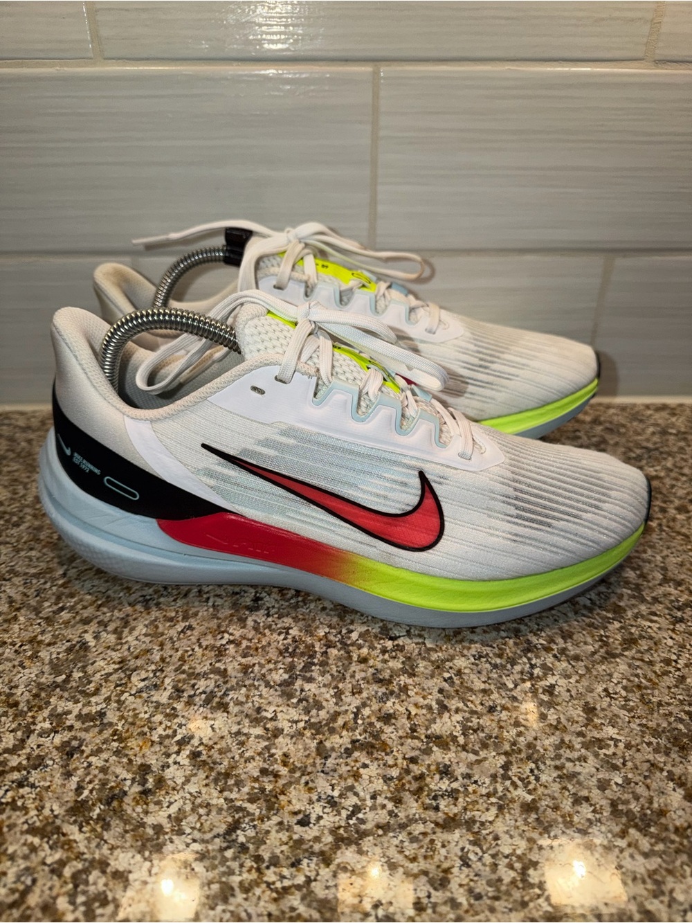 Nike White Running Shoes with Red-to-Yellow Gradient Swoosh